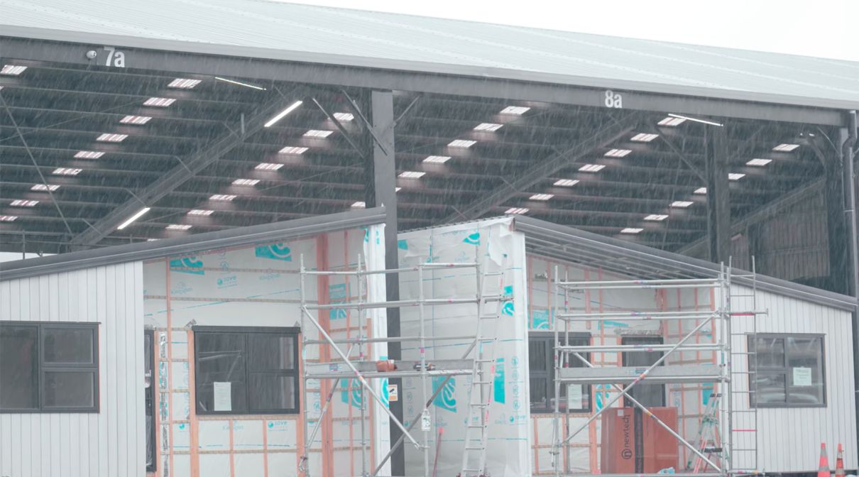 Rain doesn’t slow down construction time at Builtsmart’s covered house factories.