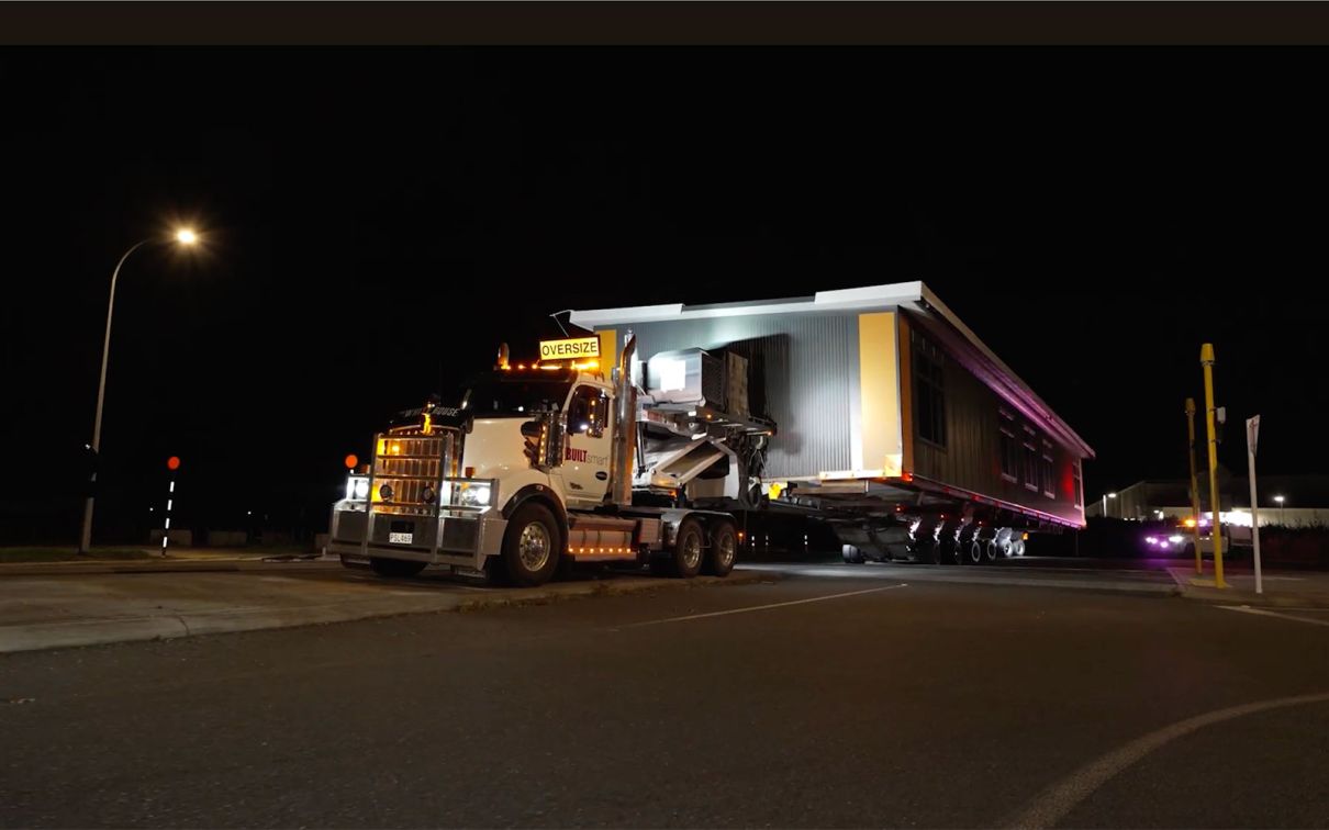 BUILTsmart transporting a 28-metre-long modular classroom to Kirikiriroa School.